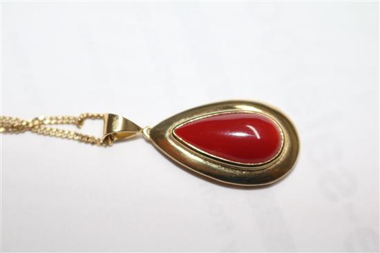 An Italian 18ct gold and pear shaped coral drop pendant, on an 18ct gold chain, pendant overall 33mm.